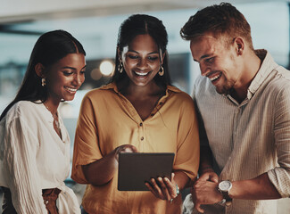 Wall Mural - Business people, night and group with teamwork, tablet and planning for project, deadline and ideas. Evening, employees and coworkers with tech, internet and research with cooperation for proposal