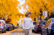 © Volodymyr - Kid walking on autumn street. Beautiful Kid in Autumn Park Outdoor. Childhood, autumn and leisure. Fall foliage.