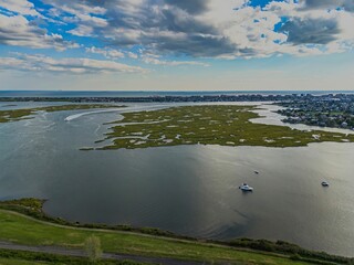 Wall Mural - High angle aerial view over Island Park, Long Island, New York on a sunny day with blue skies