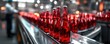 © Rafa - Red glass bottles on the conveyor belt
