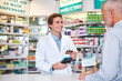 © peopleimages.com - Pharmacy, credit card and payment with people in store for medicine, advice and consulting. Medical, insurance and antibiotic prescription with pharmacist in clinic for help, drugstore and healthcare