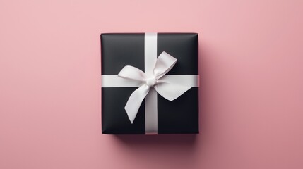 Wall Mural - Elegant Minimalist Matte Black Gift Box with White Ribbon on Pink Background for Celebrations