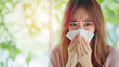 © S.JR Stocker - Asian woman sneezing and holding a tissue, suffering from allergic rhinitis