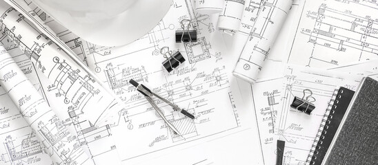 Wall Mural - architect design working drawing sketch plans blueprints and making architectural construction model in architect studio,flat lay.