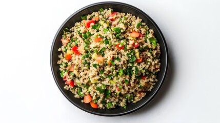 Healthy quinoa salad with fresh vegetables and herbs