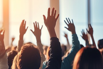 Anonymous group raises hands at seminar