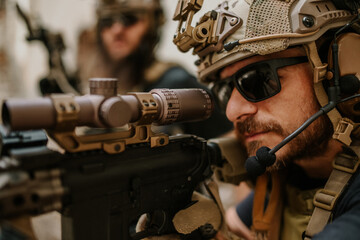 Wall Mural - Close up of shooter aiming with sniper rifle at opponent on a battlefield