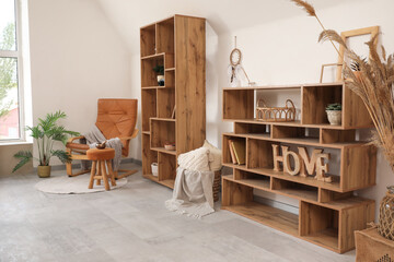 Wall Mural - Interior of living room with armchair, shelf units and Tibetan bowl on pouf