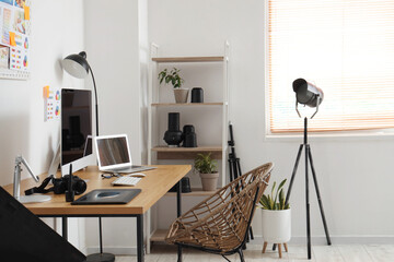 Wall Mural - Table with modern computer, photo camera and laptop in office. Photographer workplace concept