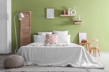 Sticker - Beautiful interior of bedroom with bed, pillows and flowers