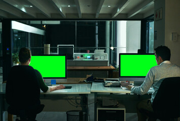 Leinwandbilder - Computer, green screen and night with business people in office together for overtime deadline. Back, design and mockup space with employee or designer team in workplace for evening programming
