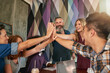 © TamJam/peopleimages.com - Creative, people and meeting with high five in cafe for project success, partnership achievement and support. Smile, staff and collaboration for winner celebration, productivity and team inclusion