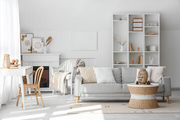 Poster - Interior of stylish living room with cozy sofa, fireplace, shelving unit and coffee table