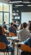 © Maria Mikhaylichenko - Students attentively listening to a lecture in a modern classroom setting, with large windows providing natural light and bookshelves lining the walls.