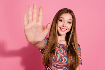 Wall Mural - Photo of cheerful adorable girl with straight hairdo wear stylish print t-shirt give you highfive isolated on pink color background