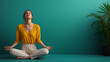 © iamfrk7 - Woman practicing yoga meditation in yellow top against teal background, emphasizing mindfulness, balance, and mental well-being, in a serene and focused pose