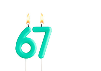 Wall Mural - Birthday number 67 - Green birthday candle on white background