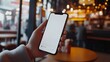 © The Little Hut - CU Photo of a person using his phone inside a fastfood restaurant Blank white smartphone screen mockup food order delivery discount coupon application mockup : Generative AI