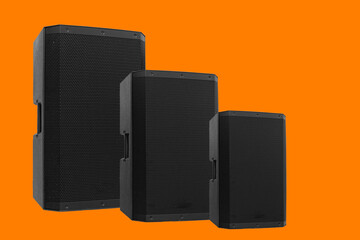 3-size professional black PA speakers stacked, orange background.clipping path.