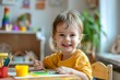 © InfiniteStudio - A cheerful child enjoys painting a colorful picture in a bright and airy room during the morning light