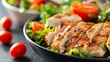 © Atchariya63 - Delicious grilled chicken served on a fresh salad with vibrant vegetables, perfect for a healthy meal or recipe inspiration.