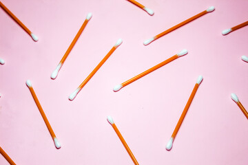 cotton swabs isolated on pink background