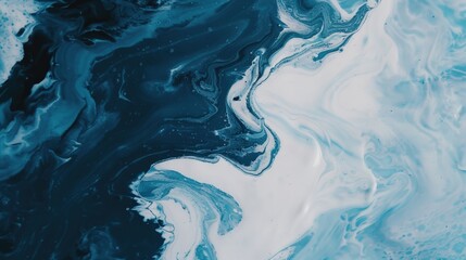 Beautiful abstract waves of blue and white paint create a soothing and artistic background for various creative projects.