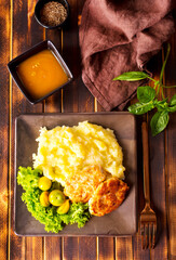 Canvas Print - Chicken cutlets with mashed potatoes, meat cutlets with mashed potatoes and tomatoes