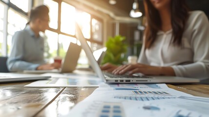 Wall Mural - Businesspeople working in office with laptop in a portrait shot with copy space, plain background