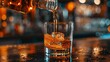 © Sinechana - 91. Detailed view of a bartender pouring whiskey into a glass, the amber liquid flowing smoothly. The bar background, with its warm lighting and elegant , is slightly out of focus, making the pour