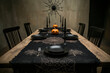 © Vasyl Onyskiv - Eerie Halloween table setting with black plates, candles, spiderweb decor on dimly lit background. Spooky dining concept