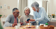 © David/peopleimages.com - Smartphone, tea and senior friends at table for funny meme, snacks and retirement together in house. Group, surprise and man with elderly women for breakfast, happiness and excited with smile