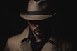 © Yeivaz - Mysterious Detective in Shadowy Silhouette wears a Fedora Hat and Trench Coat on black background