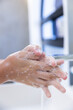 © Wavebreak Media - At home, Woman washing hands with soap, person maintaining hygiene in spa setting