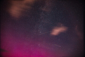 Aurora borealis Amazing Night Starry Sky. Bright Dramatic Perseids meteors Trails Of Stars And Meteors. Sky In Different Colors. From Dusk Till Dawn. Misty Night. Natural Background