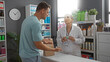 © Krakenimages.com - Woman pharmacist assisting man customer in a brightly lit pharmacy interior with shelves of various pharmaceutical products and a visible clock on the wall