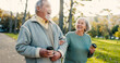 © David/peopleimages.com - Senior couple, park and morning walk with conversation, love and bonding together with health. Wellness, marriage and retirement with outdoor, communication and coffee on urban garden path on date