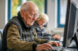 © Lubov - Senior man engaging in computer learning, symbolizing lifelong education and digital literacy. Perfect for educational content,