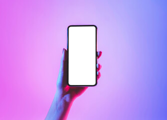 Hand holds smartphone with blank screen in neon, free space