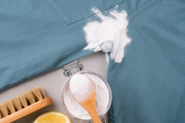 Natural cleaning method to remove sweat stains under the armpits. Eco-friendly remove stains from clothes using baking soda. Embracing a zero-waste lifestyle. top view.