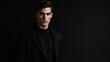© Pricha.RT - A male model dressed in all-black attire standing confidently against a solid black backdrop.