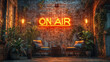 © EJManzaneque - A room with a backdrop of a brick wall with a neon sign that says “On Air” and two chairs.