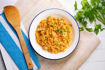 Rice paella with fresh tuna. Top view table.