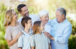 © Flashizzle/peopleimages.com - Smile, big family and generations outdoor on holiday together for funny conversation, bonding and love. Happy mother, father and children with grandparents, people and siblings laughing in nature