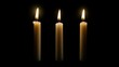 © Business Image - Three illuminated candles on black background - serenity and meditation theme