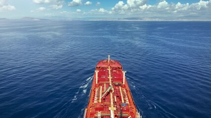 Wall Mural - Top POV view of a chemical goods or oil tanker sailing with speed over the ocean as a concept for the fuel industry