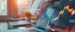 © Ai Studio - A laptop on a desk displaying colorful financial charts and graphs, bathed in warm sunlight entering through a nearby window.