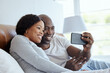 © peopleimages.com - Happy black couple, phone and video call in bed for communication, talk or relax. Man, woman and virtual chat in bedroom for news, story or live streaming for recording memory online for love in home