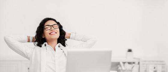 Break At Work. Hispanic businesswoman relaxing at workplace, copy space, selective focus