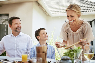 Wall Mural - Food, family and green salad with vegetables, family and party with summer event, nutrition and ingredients. Parents, recipe and son with lunch, eating and organic with cuisine, child and gourmet